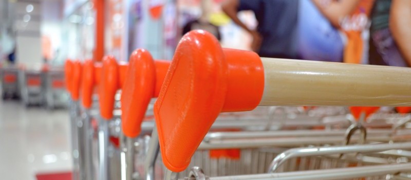 A group of shopping carts at a grocery store