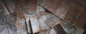 Some old maps spread across a table