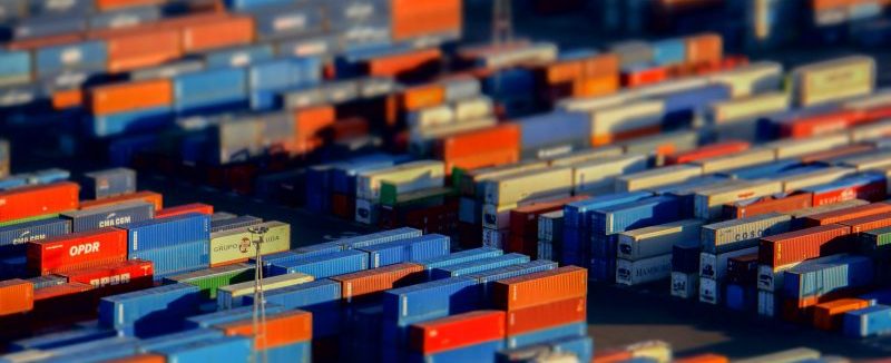 A zoomed out image of a shipping yard full of shipping containers